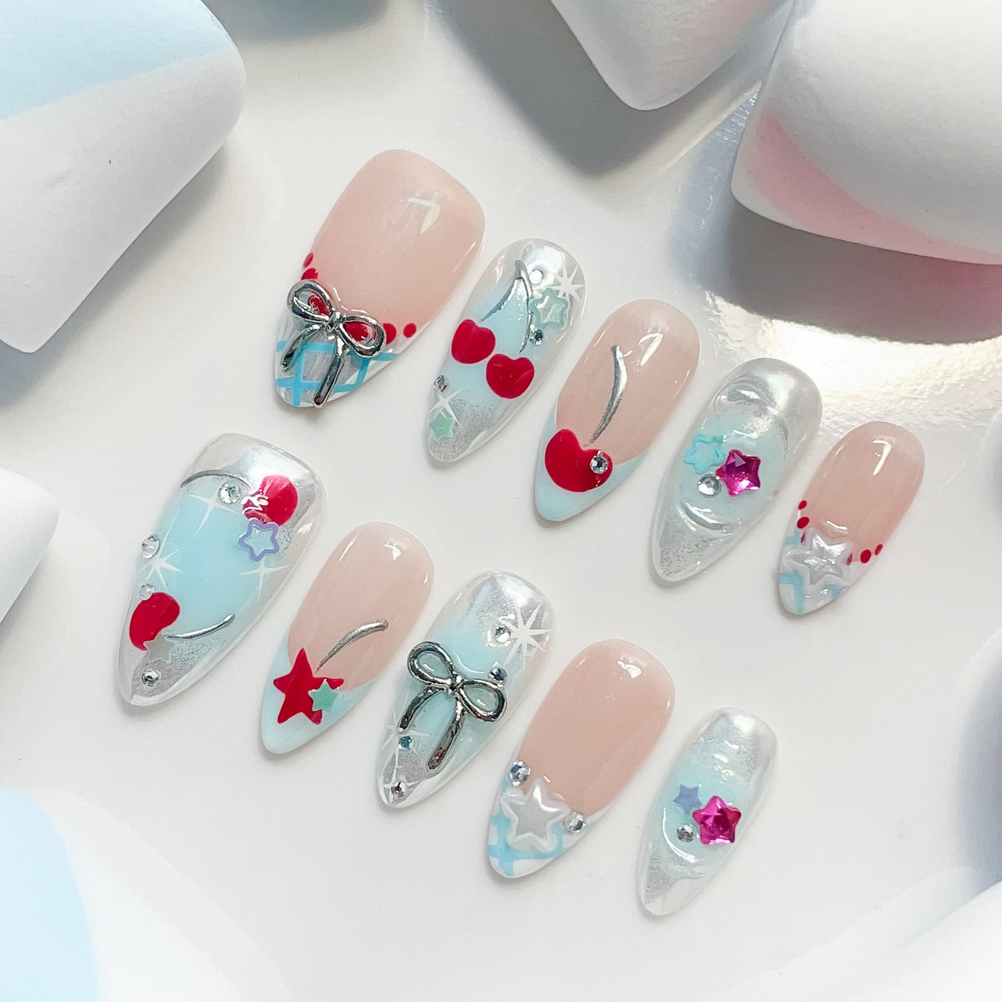medium length light blue almond press on nails with star and cherries design