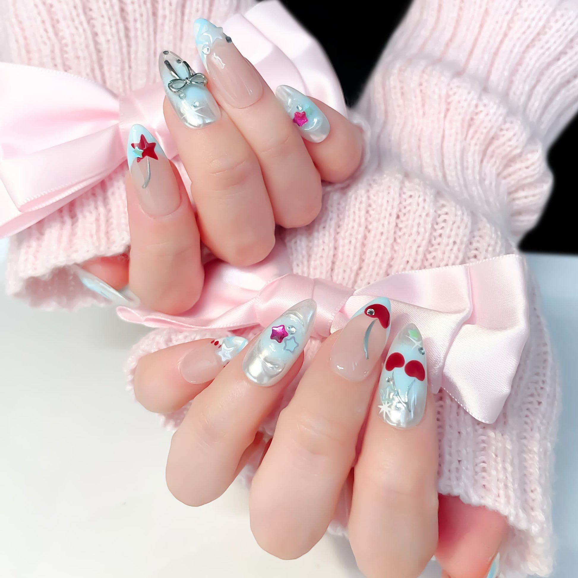 medium length light blue almond press on nails with star and cherries design
