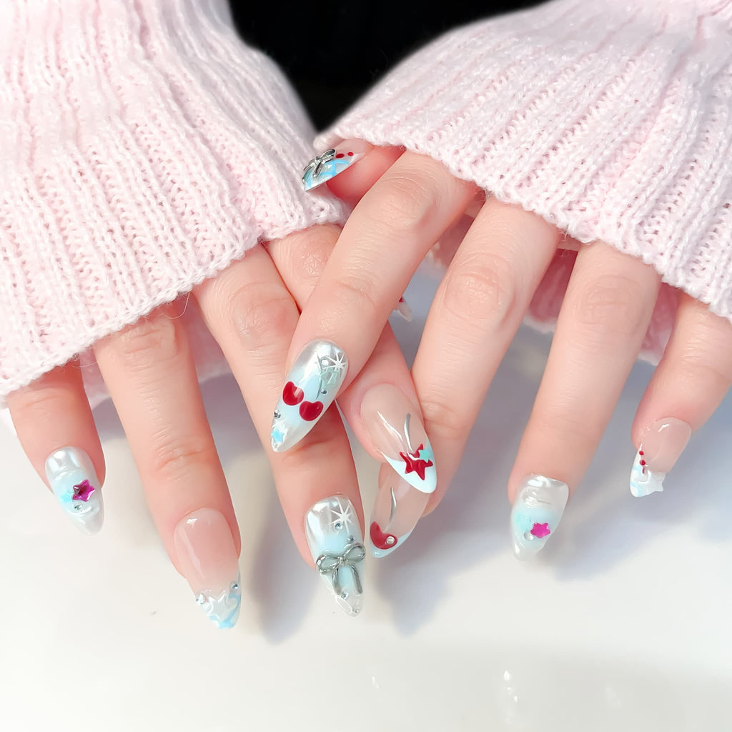 medium length light blue almond press on nails with star and cherries design