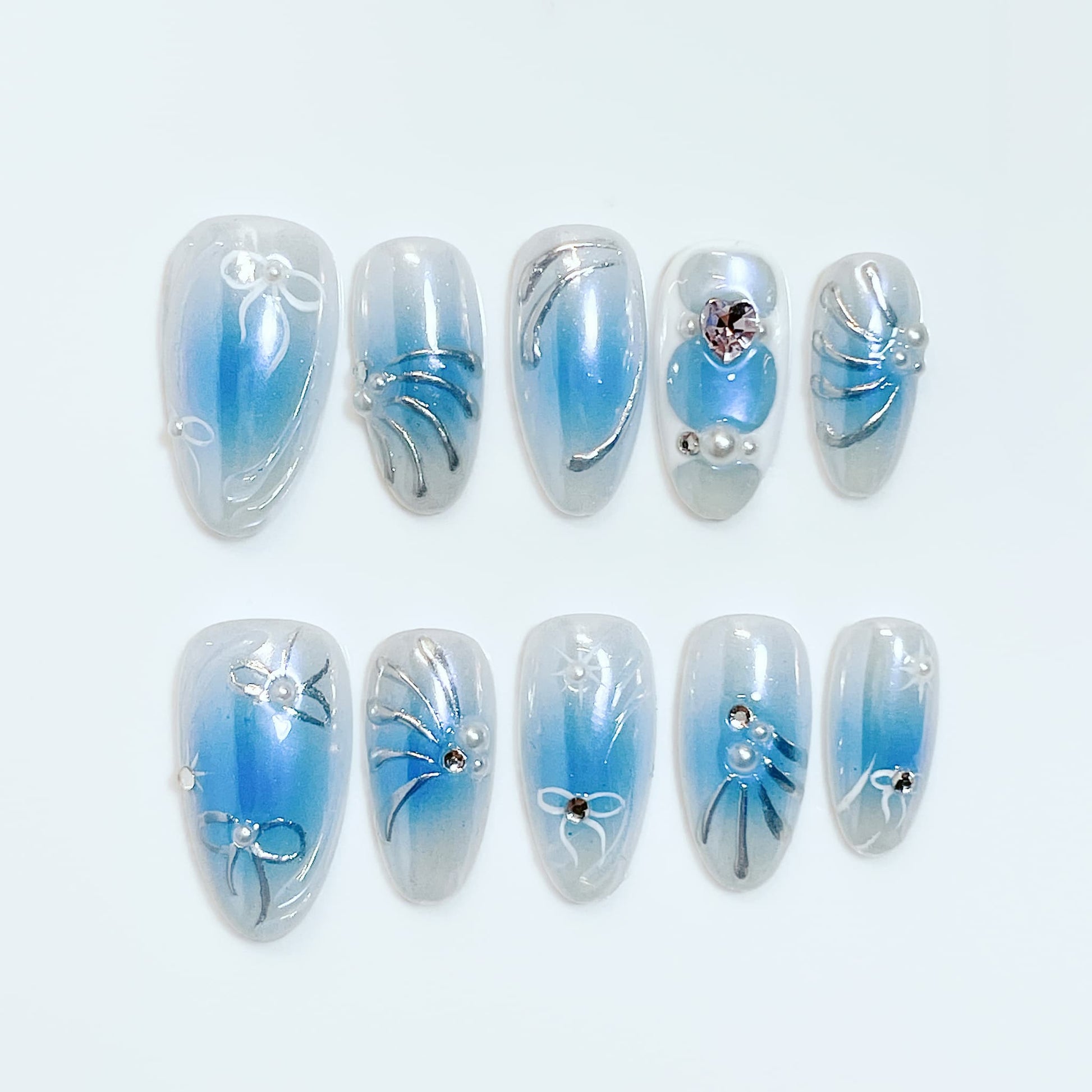 medium length blue almond press on nails with bow and pearl design