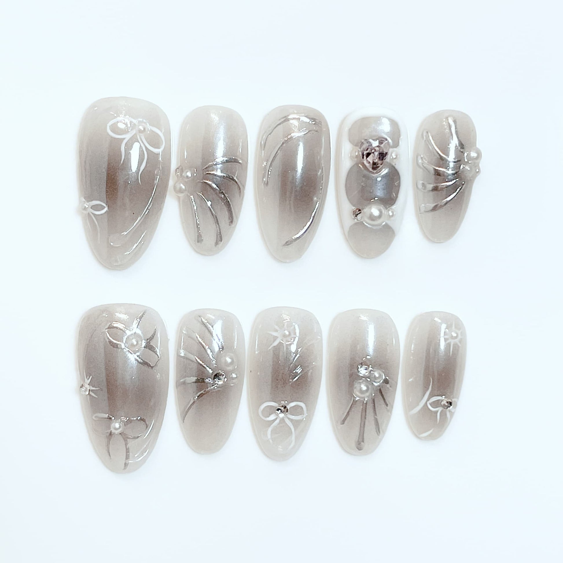 medium length gray almond press on nails with bow and pearl design