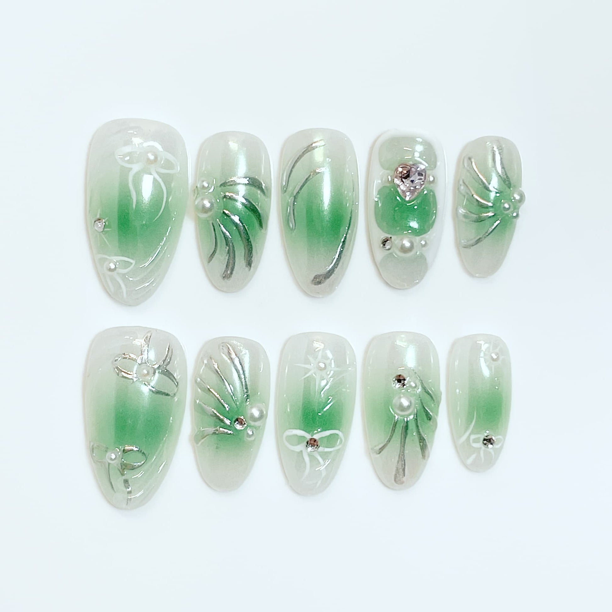 medium length green almond press on nails with bow and pearl design