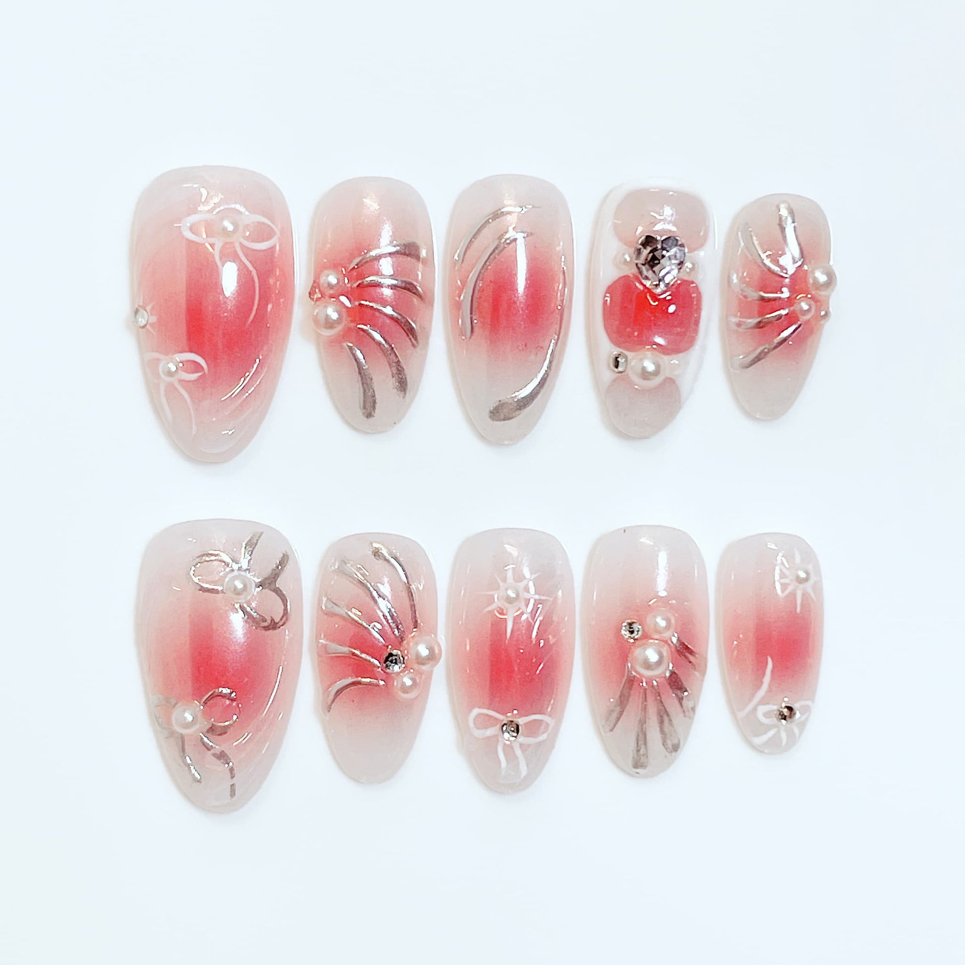 medium length red almond press on nails with bow and pearl design