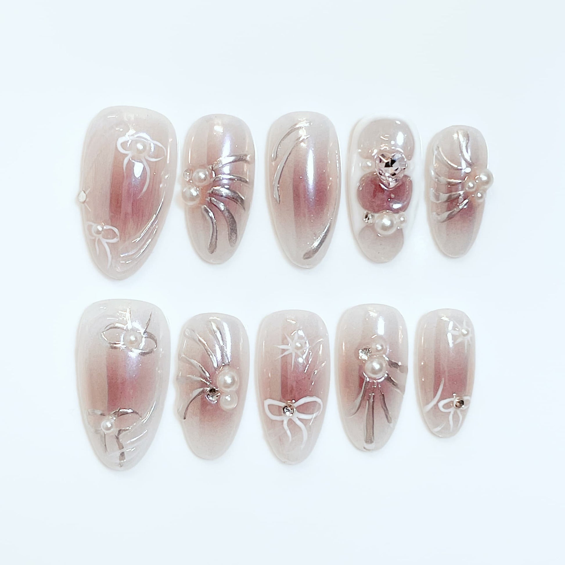 medium length rosybrown almond press on nails with bow and pearl design