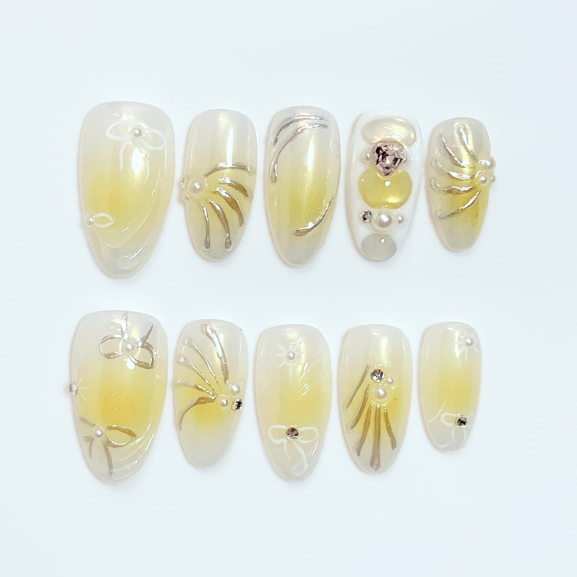 medium length yellow almond press on nails with bow and pearl design