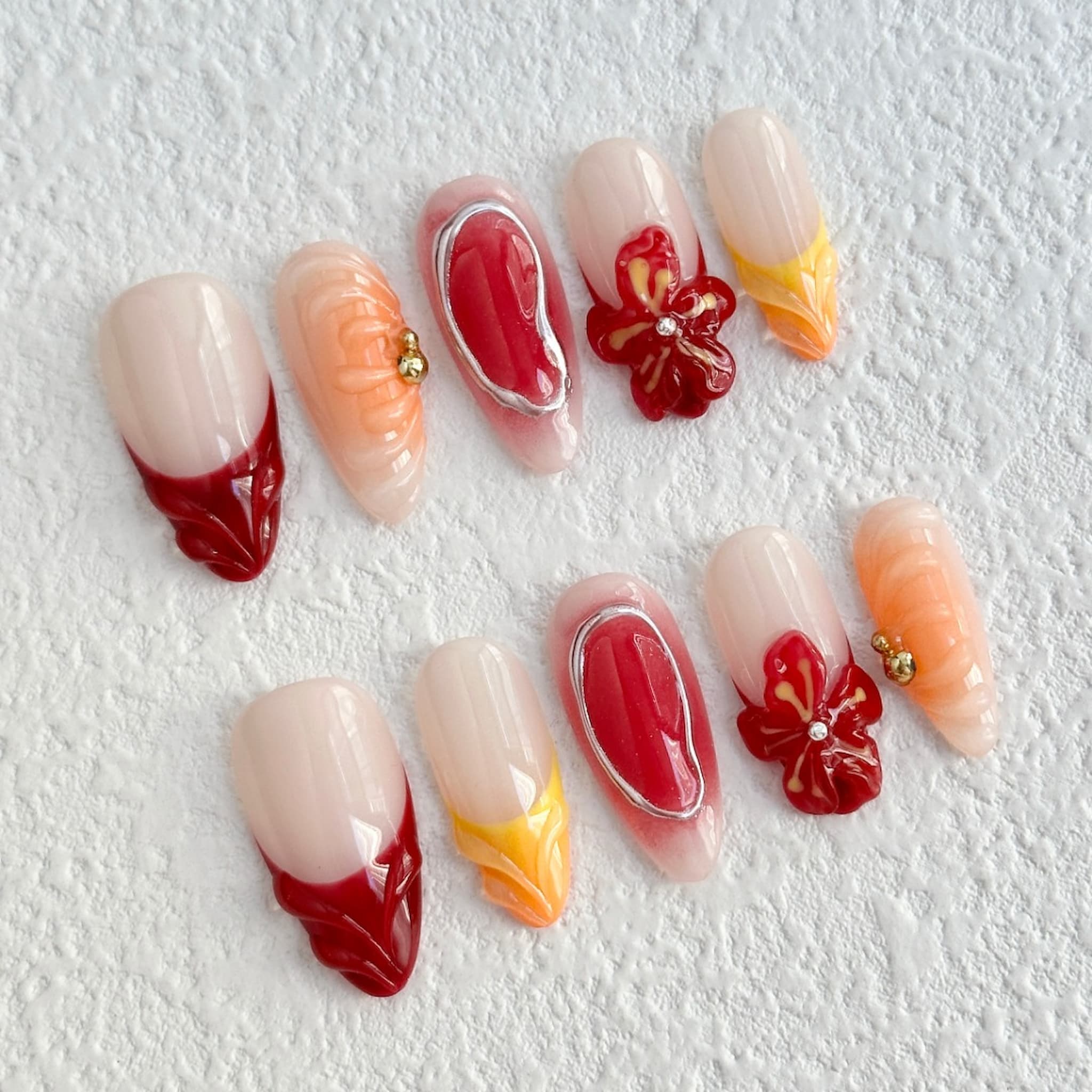 medium length fire brick almond press on nails with flower design