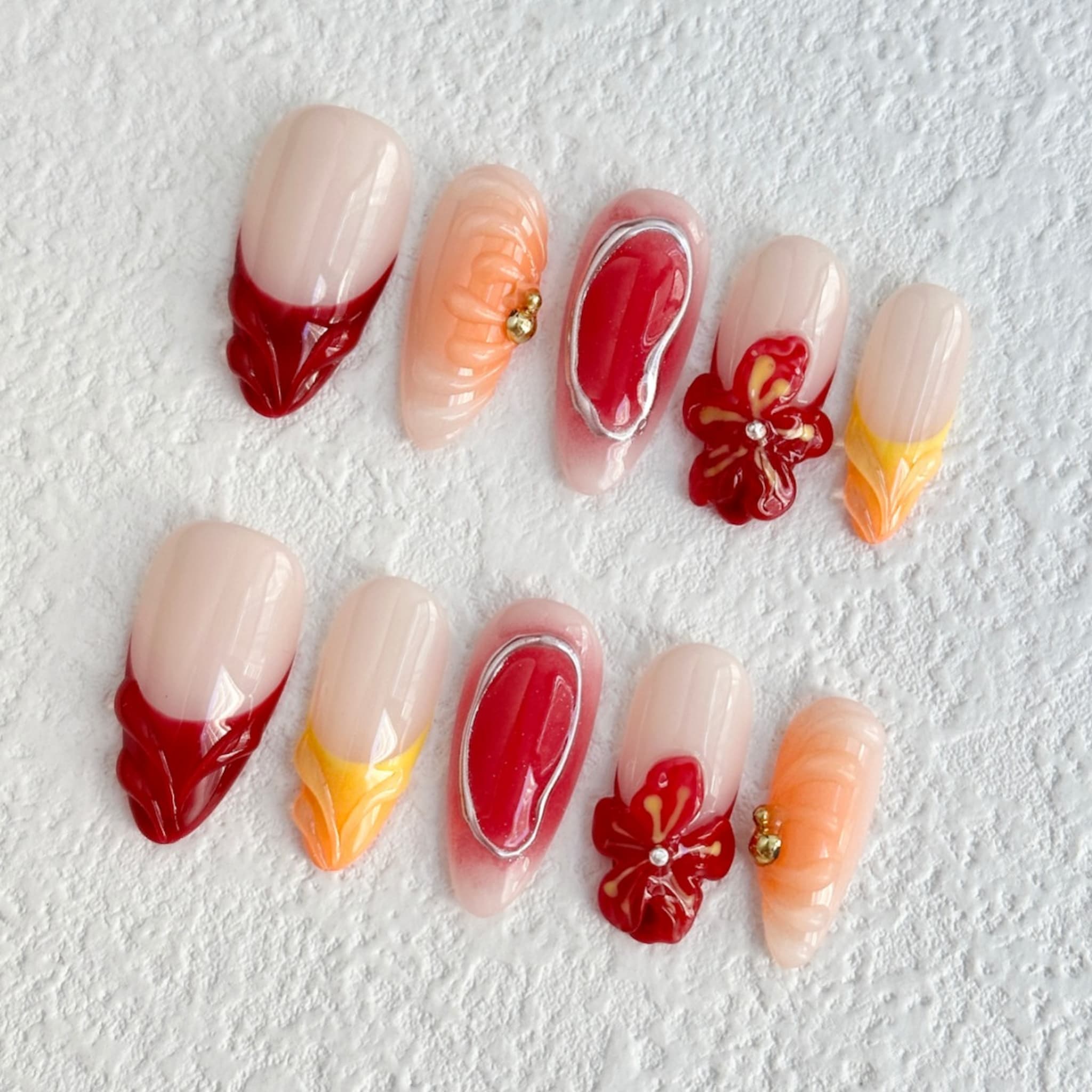 medium length fire brick almond press on nails with flower design