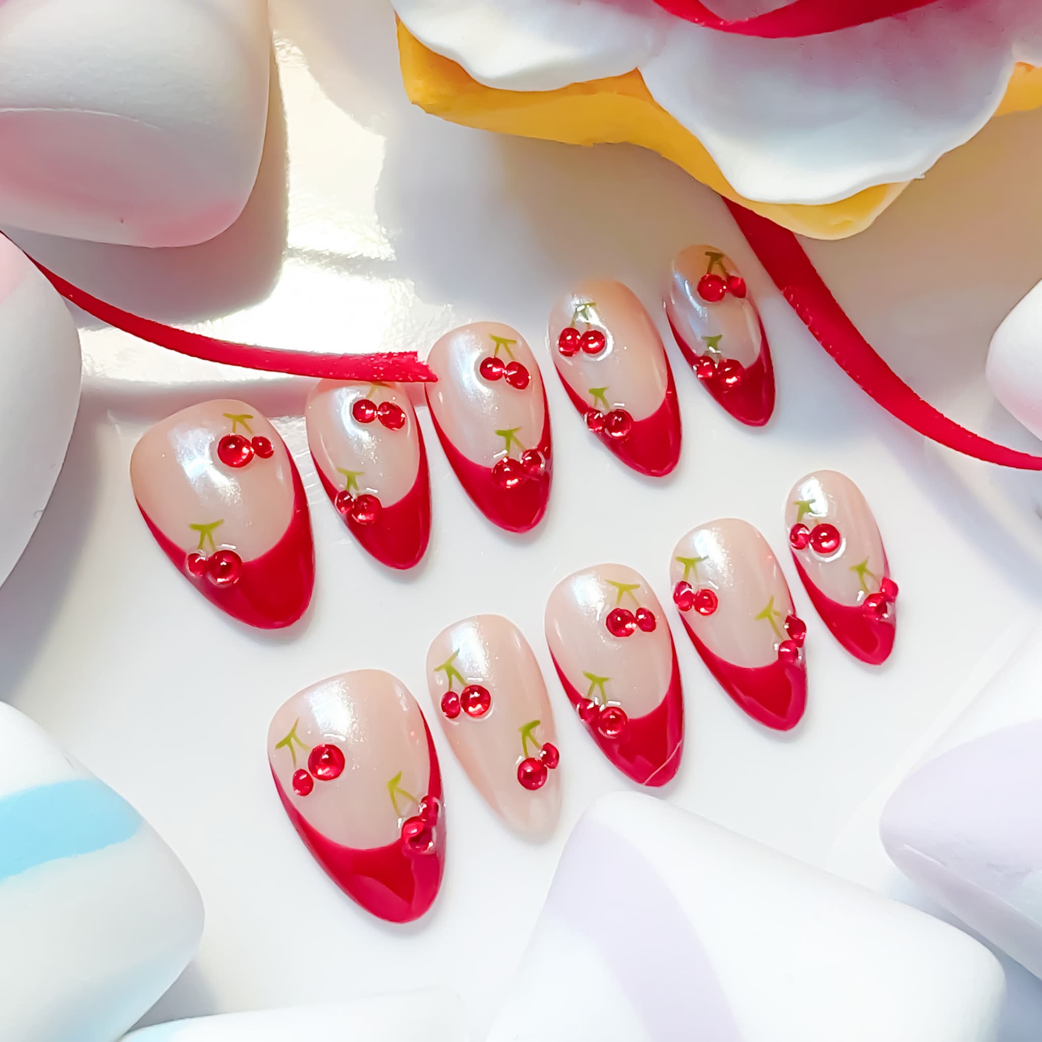 medium length dark red almond press on nails with french tips cherry design
