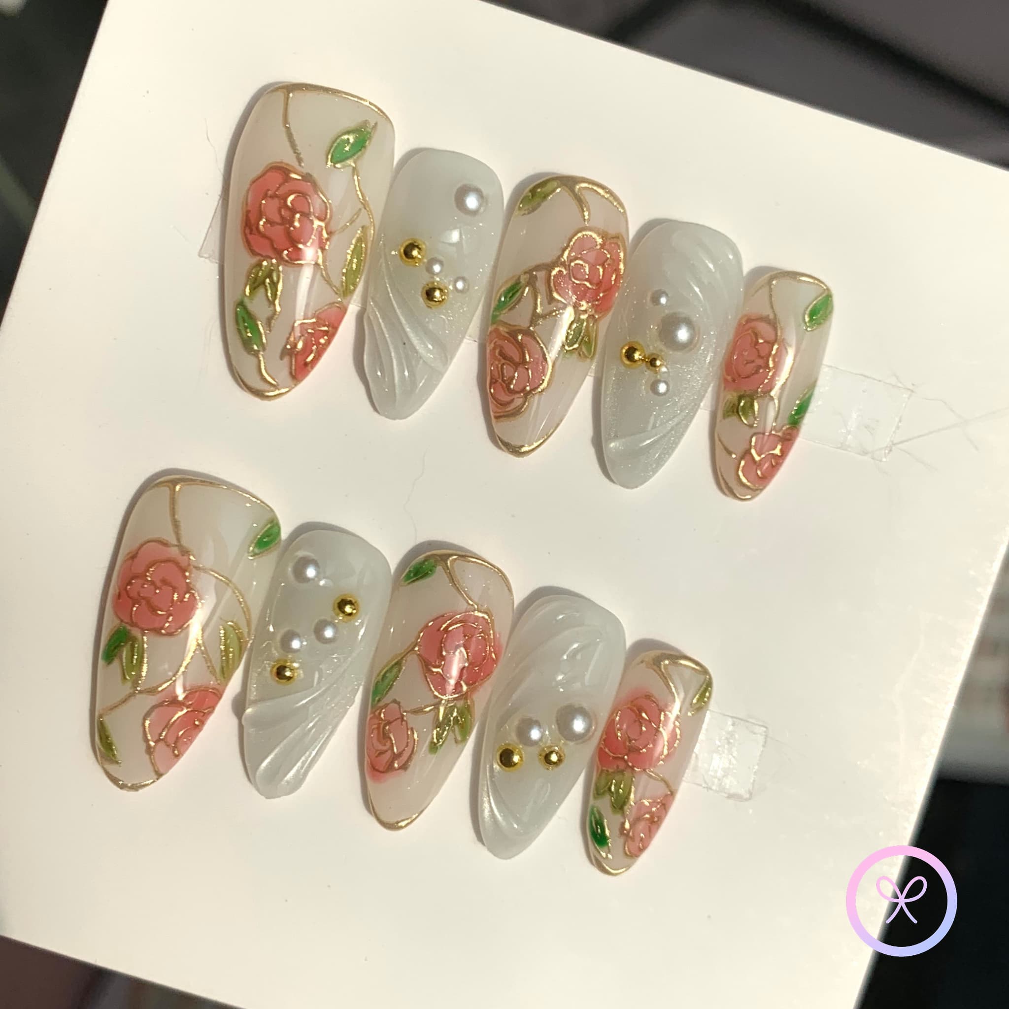 elegant white glossy medium almond press on nails with gilded roses and swirls