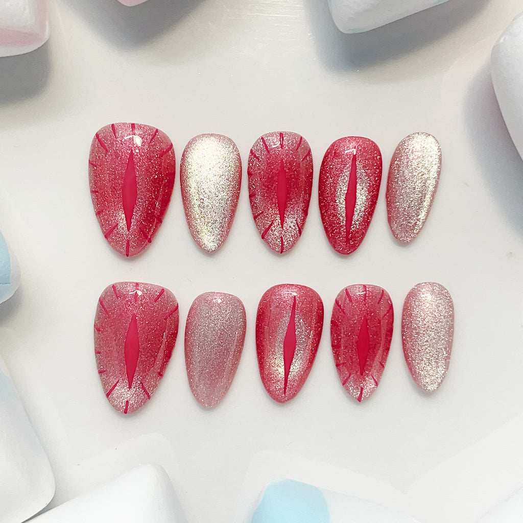 short length red almond press on nails with cat eye design