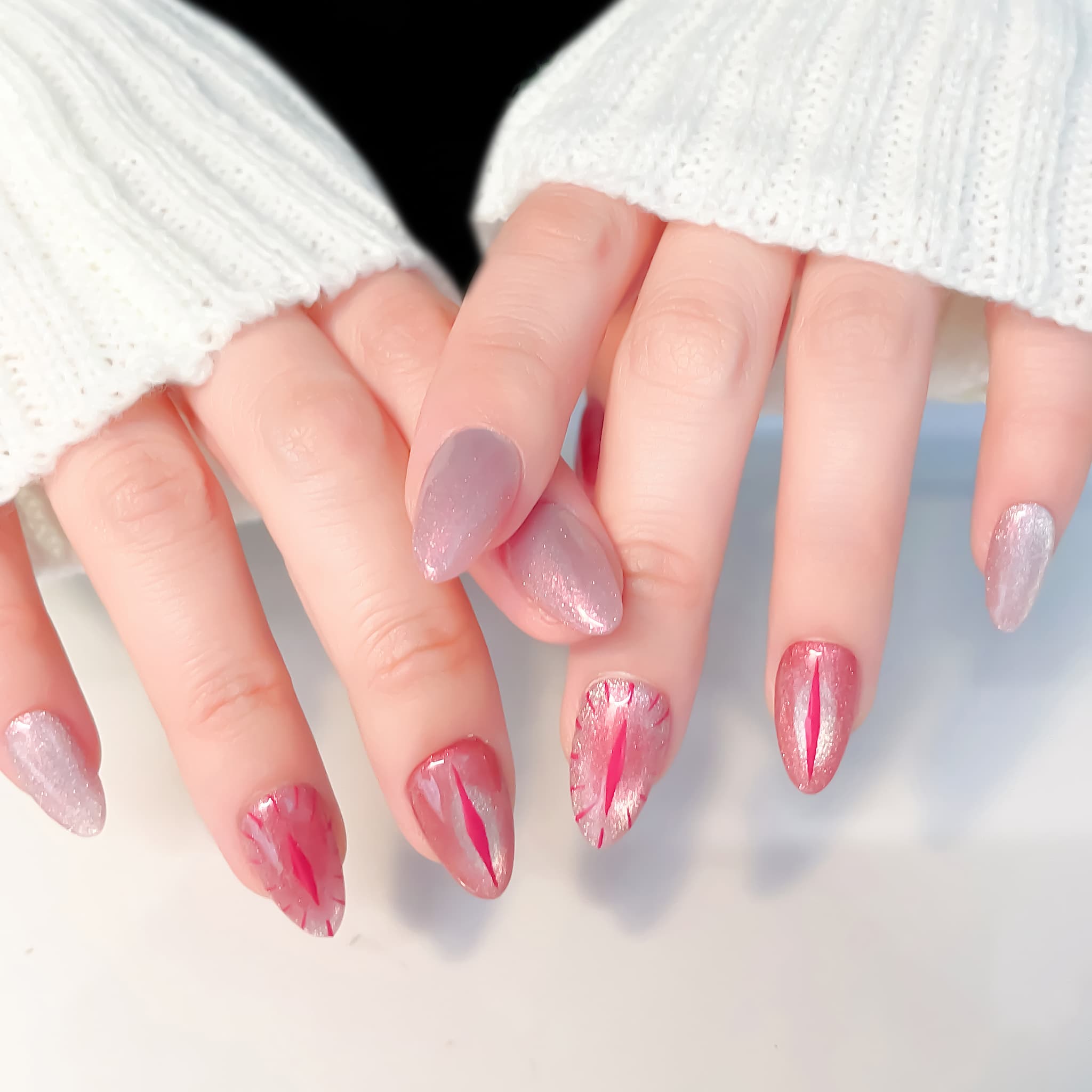 short length red almond press on nails with cat eye design