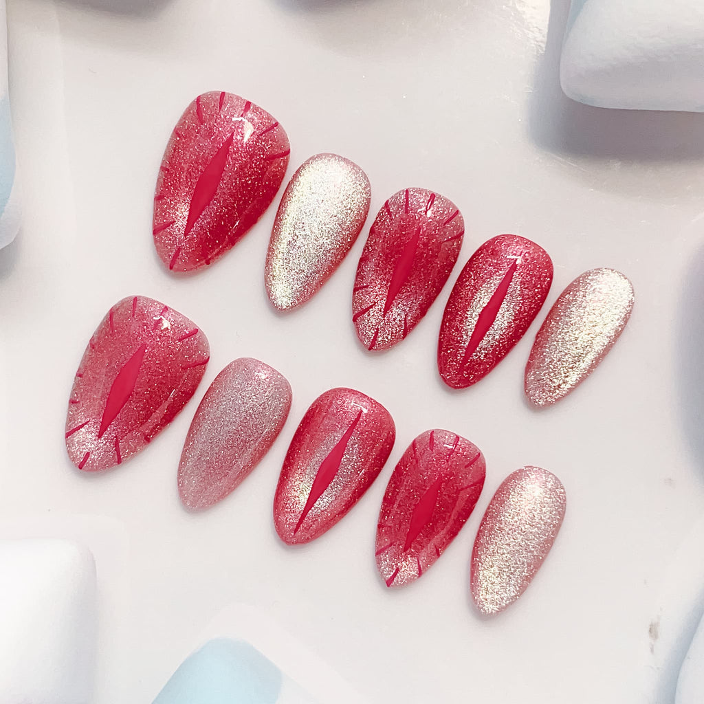 short length red almond press on nails with cat eye design