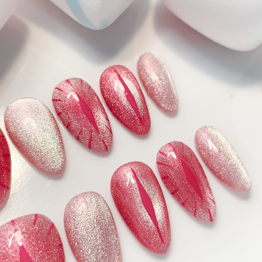 short length red almond press on nails with cat eye design