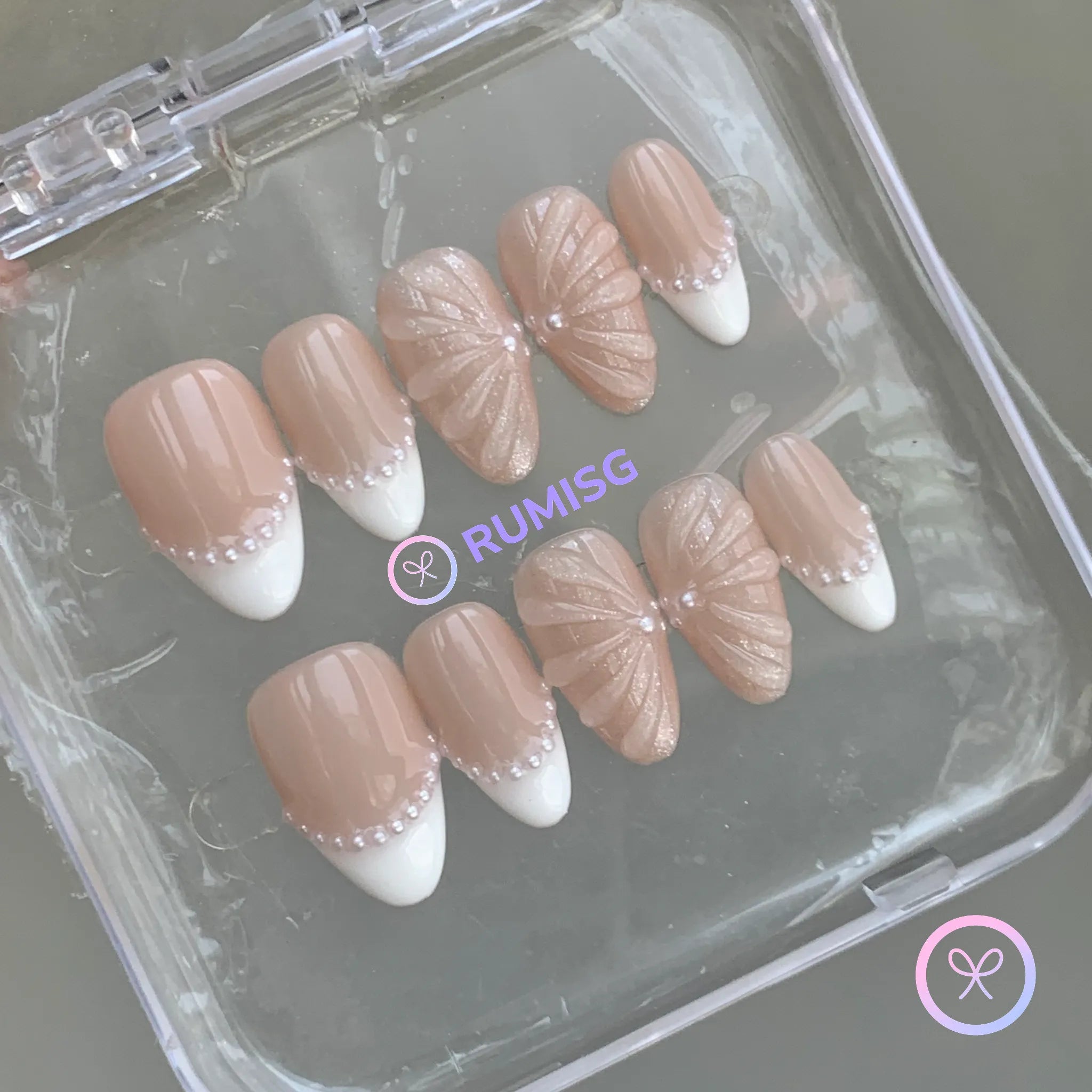 pearlcore nude glossy short almond press on nails with pearl linework french tip