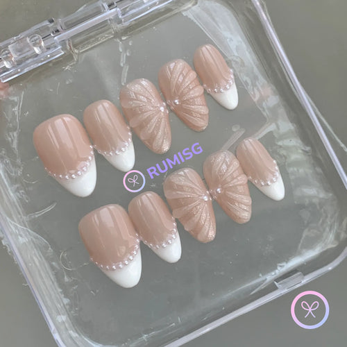 pearlcore nude glossy short almond press on nails with pearl linework french tip