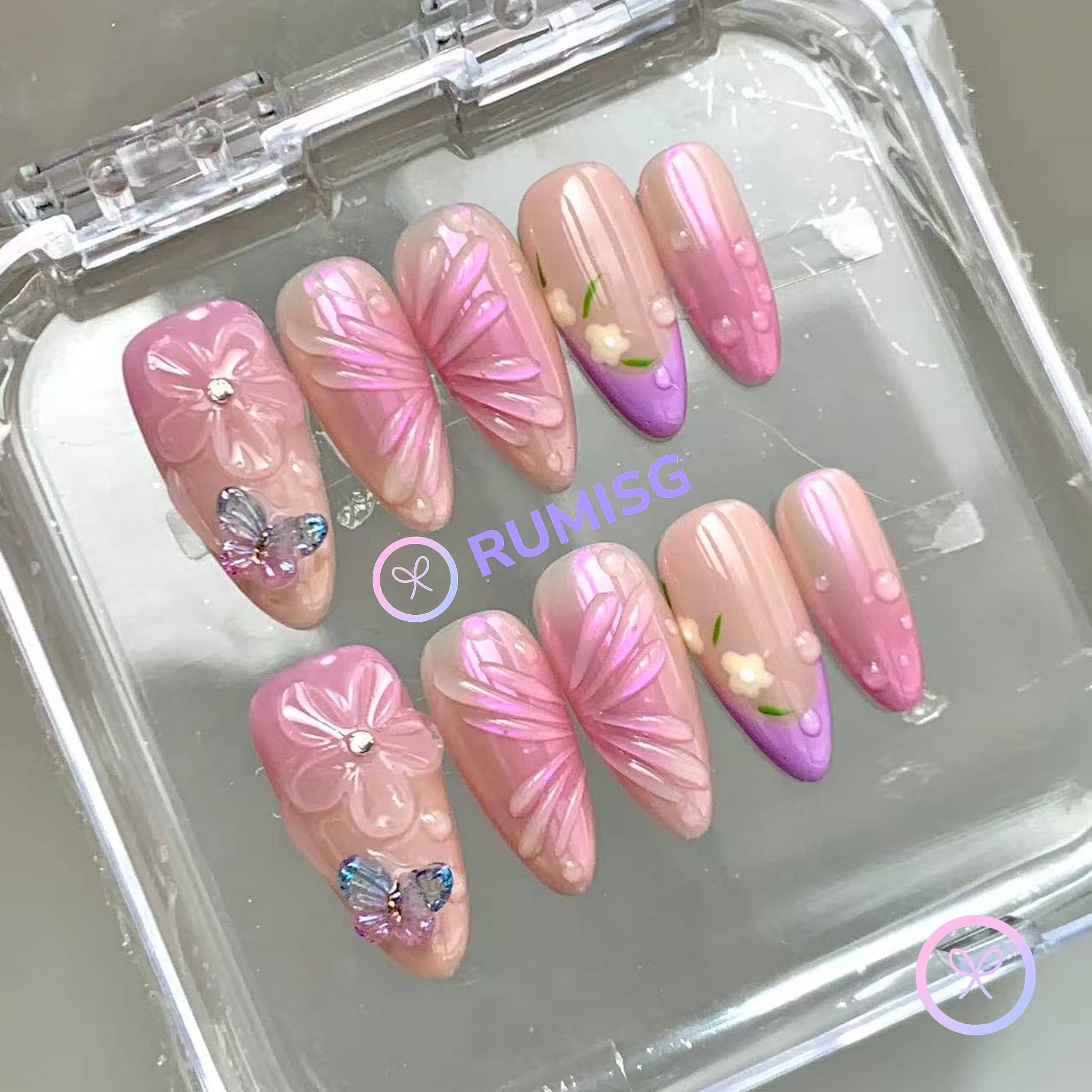 elegant pink glossy medium almond press on nails with embossed bloom flower and crystal butterfly charm
