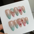 fruitcore nude glossy medium almond press on nails with clouds motifs and fruits like strawberry and cherries