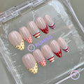 pastelcore nude glossy short almond press on nails with polka dot and candy stripe french tip