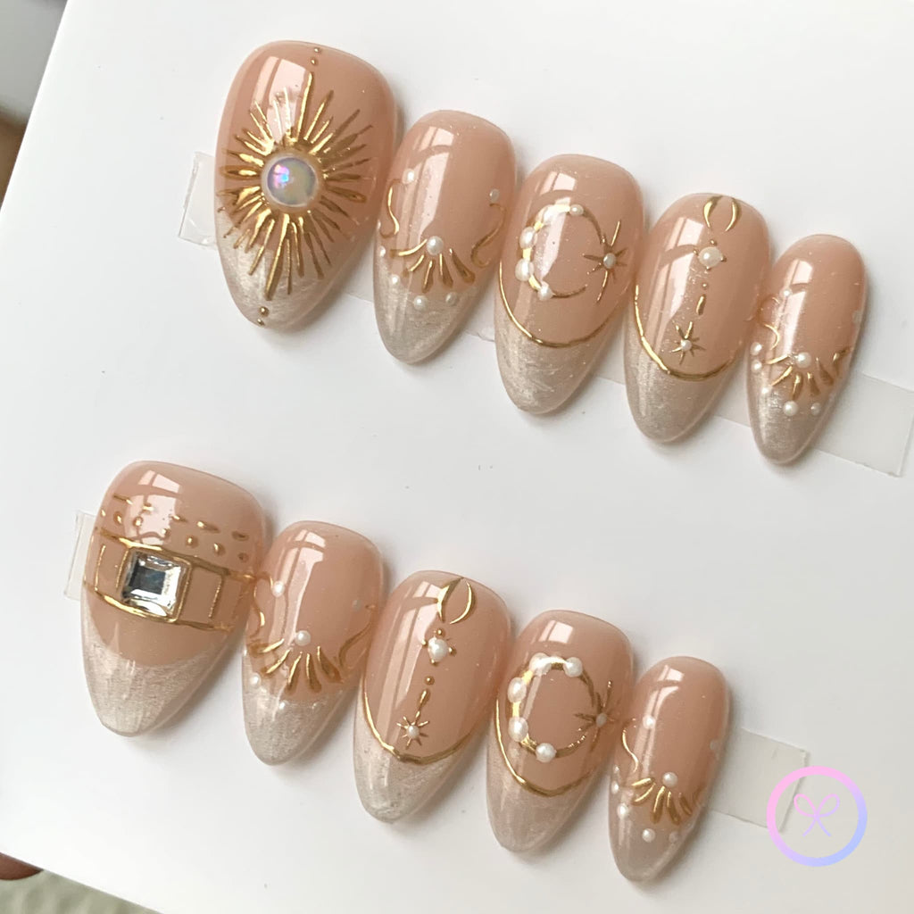 elegant nude glossy short almond press on nails with filigree and glitter