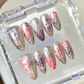 celestial pink glossy medium almond press on nails with starburst and bow