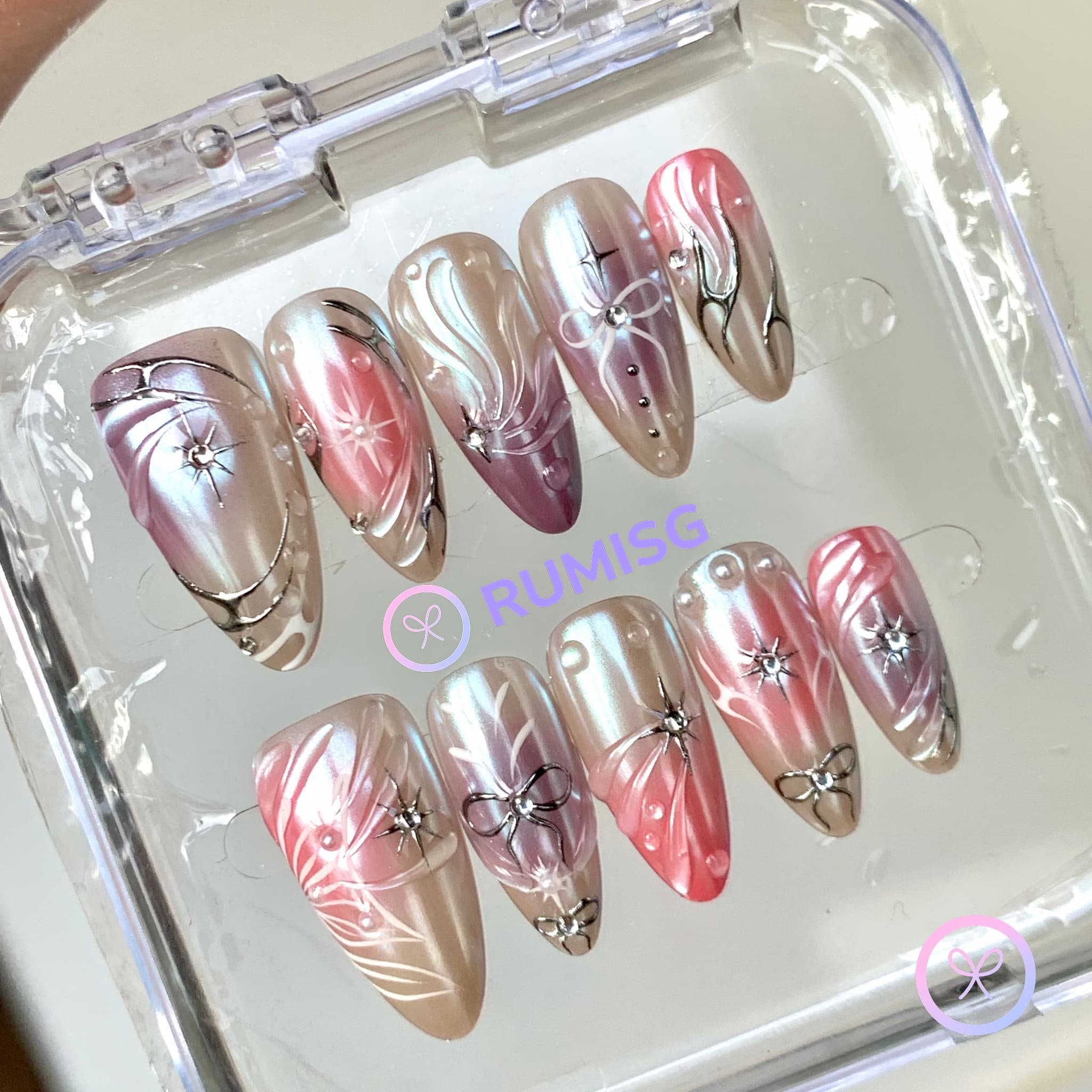 celestial pink glossy medium almond press on nails with starburst and bow