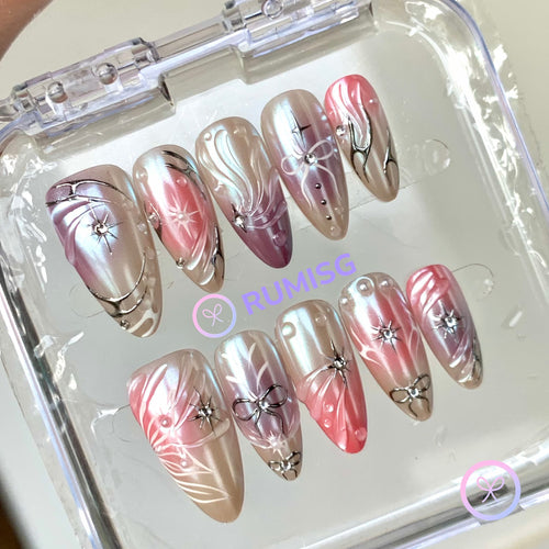 celestial pink glossy medium almond press on nails with starburst and bow