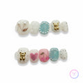 cute white glossy short squoval press on nails with bear and snail motifs