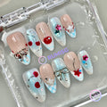 fruitcore cyan glossy medium almond press on nails with cherry and bow charm