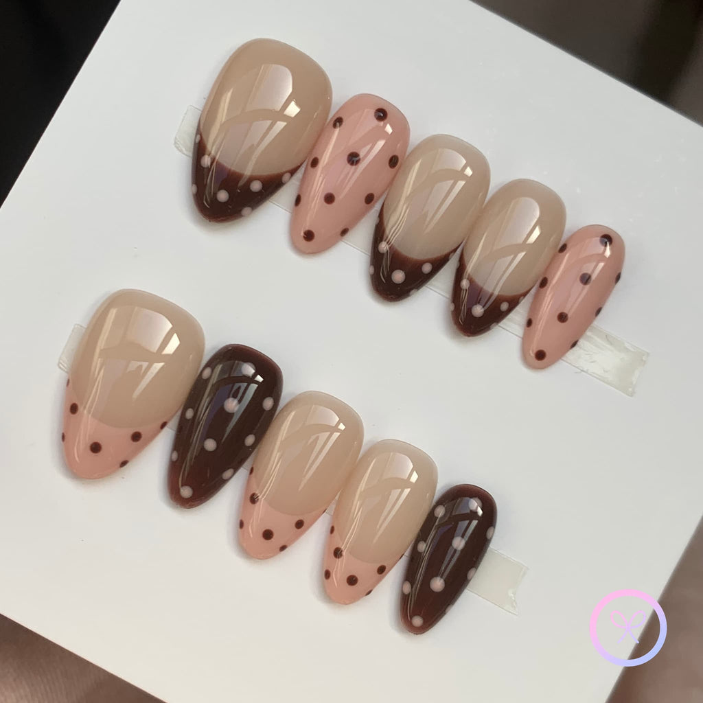 cute nude glossy short almond press on nails with polka dots and french tips design