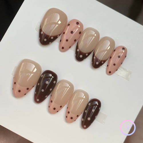 cute nude glossy short almond press on nails with polka dots and french tips design