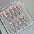  y2k silver chrome long stiletto press on nails with silver heart and sword charm