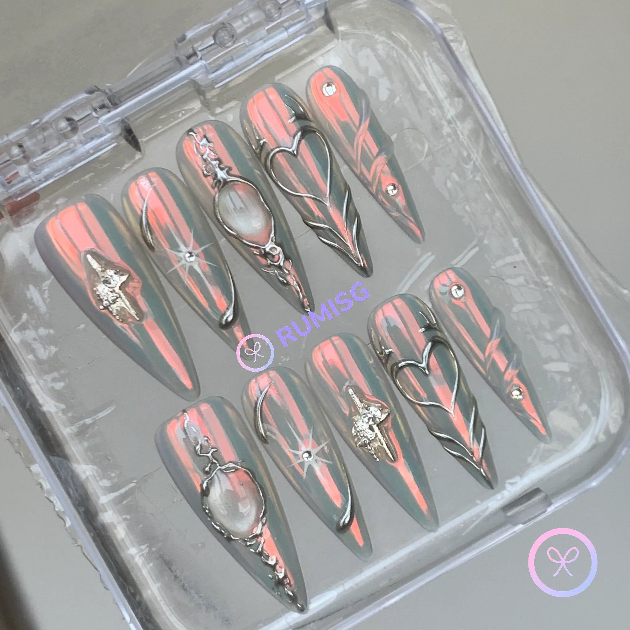  y2k silver chrome long stiletto press on nails with silver heart and sword charm