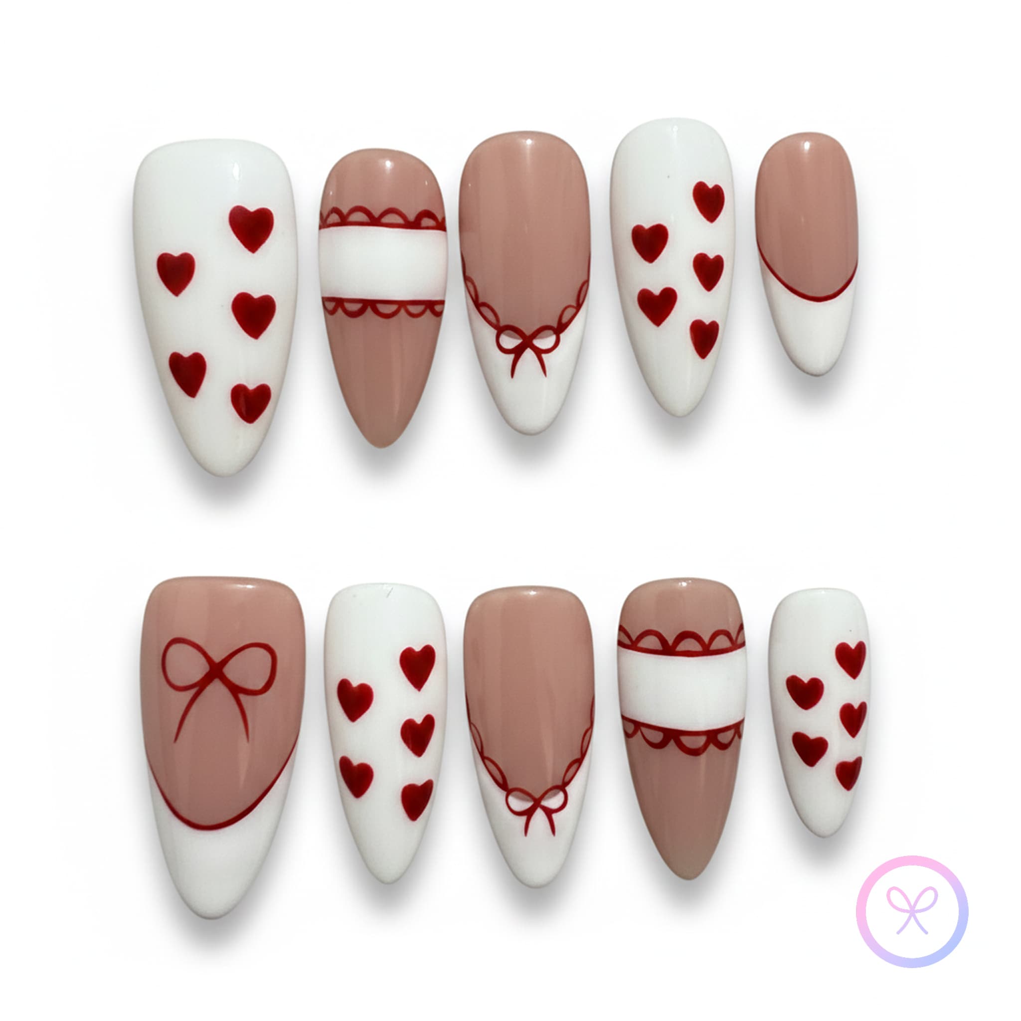 coquette nude glossy medium almond press on nails with heart shape motifs and lace and bows