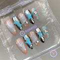 celestial cyan glossy medium almond press on nails with starburst and bloomscales