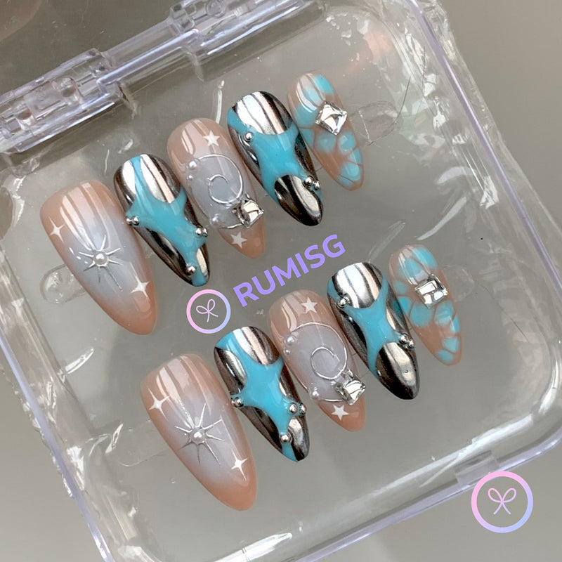 celestial cyan glossy medium almond press on nails with starburst and bloomscales