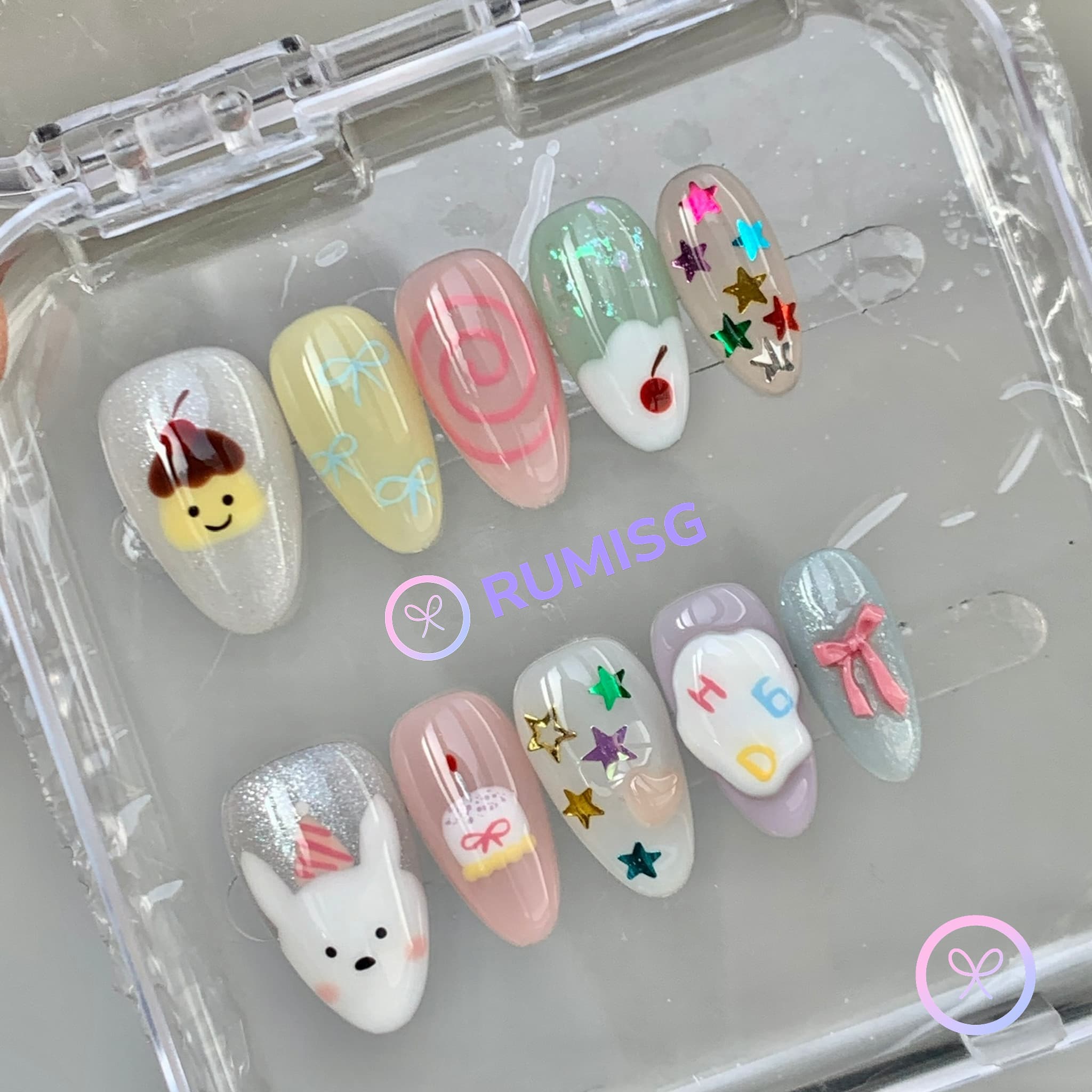 cute white glossy short almond press on nails with birthday cake and multicolor star confetti