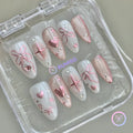 coquette pink glossy medium almond press on nails with bow and heart motif