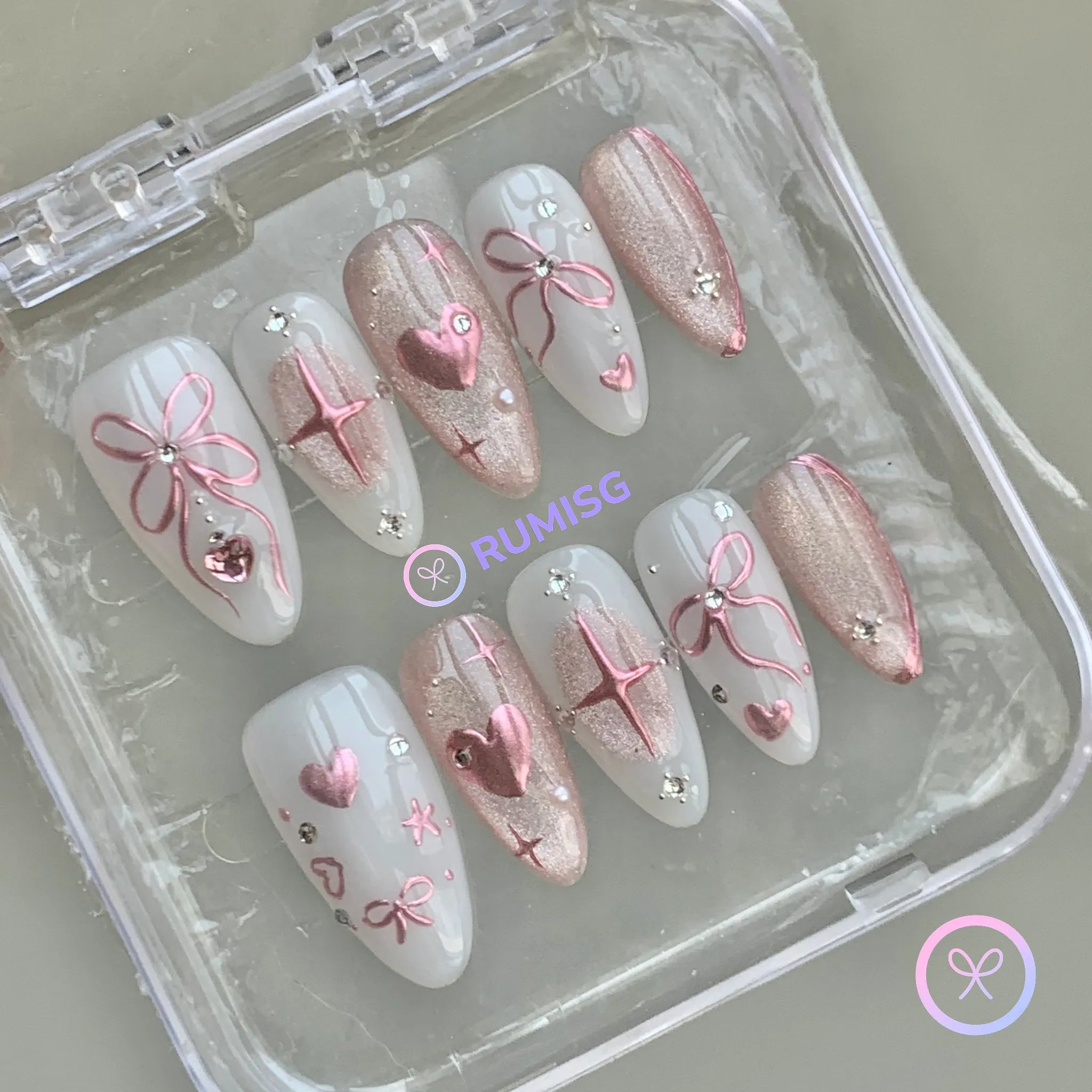 coquette pink glossy medium almond press on nails with bow and heart motif