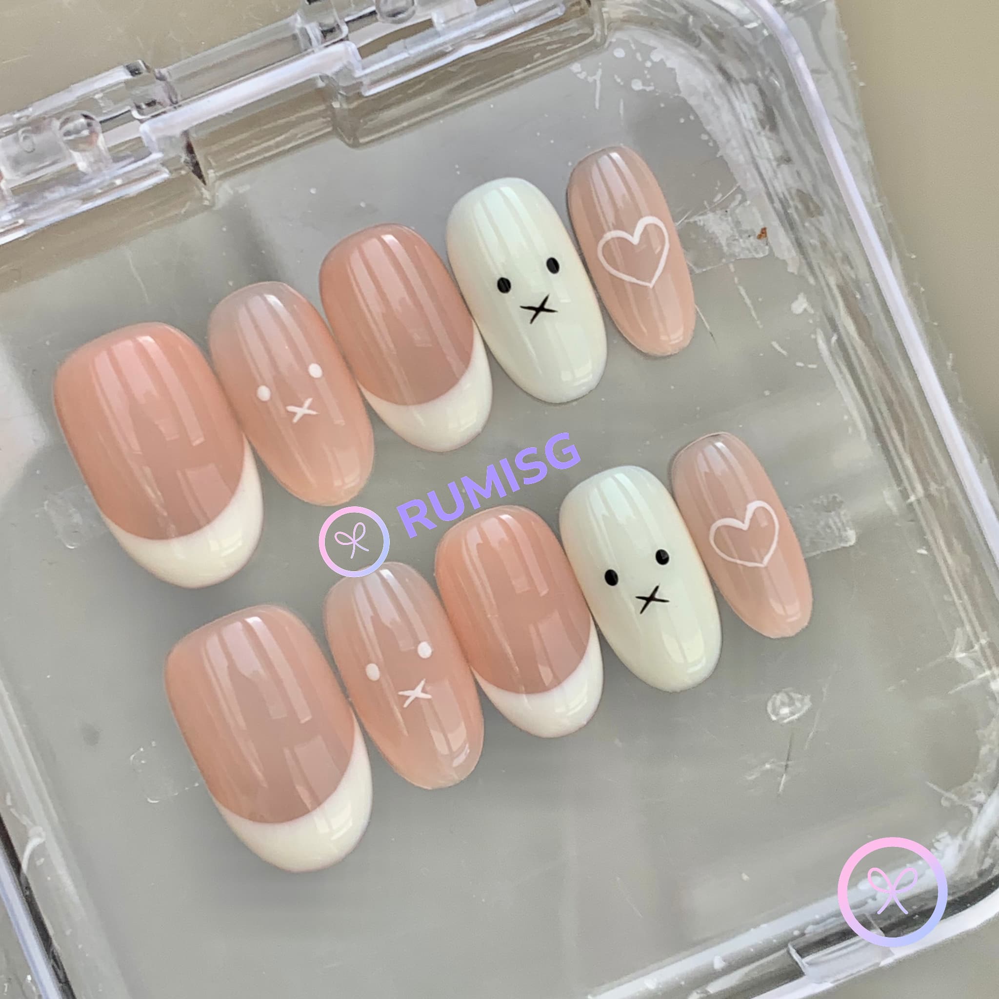 cute nude glossy short oval press on nails with doodle face and heart