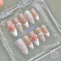 elegant nude glossy medium almond press on nails with mediterranean tile linework and 3d flower