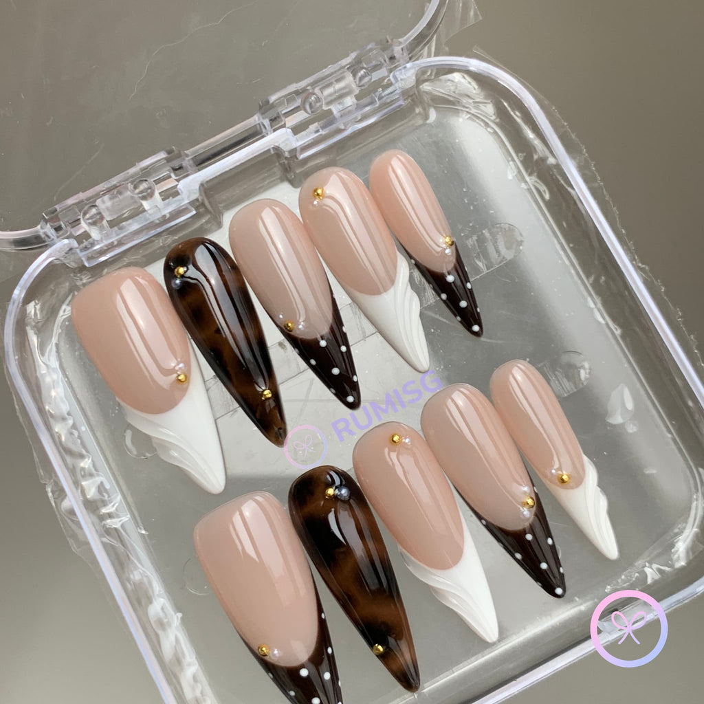 animal print nude glossy long stiletto press on nails with siwrls and gold beads and polka dots