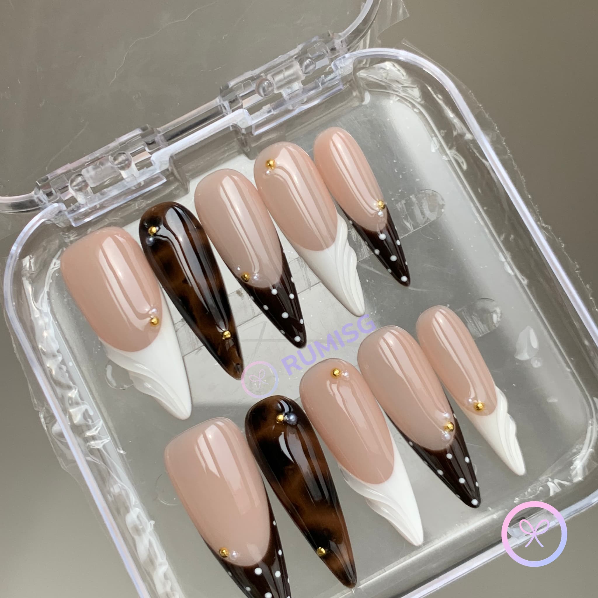 animal print nude glossy long stiletto press on nails with siwrls and gold beads and polka dots