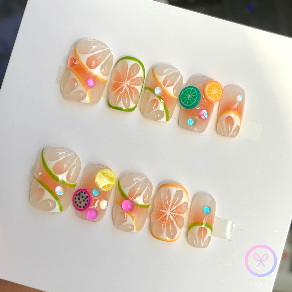 fruitcore orange glossy medium square press on nails with lemon and orange motifs