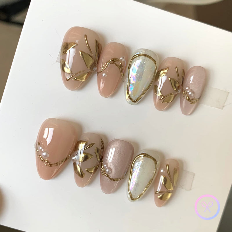 elegant nude glossy short almond press on nails with gingko leaves and cat eye