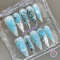 y2k blue and white glossy long stiletto press on nails with butterfly wing and pearl detail