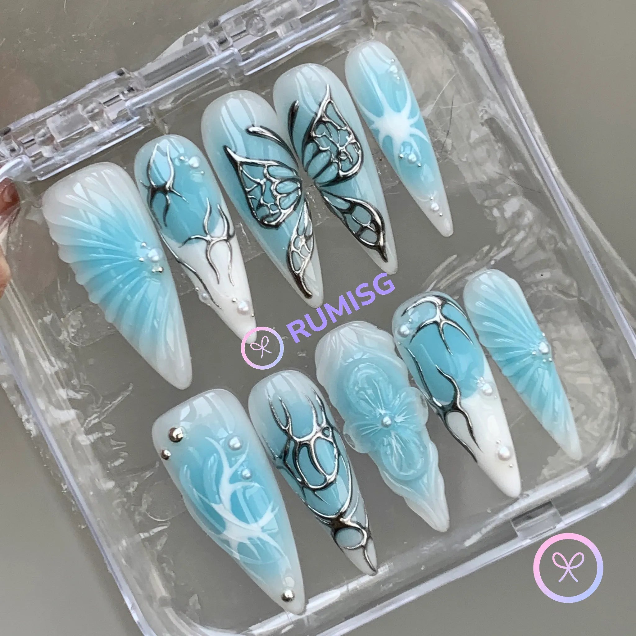 y2k blue and white glossy long stiletto press on nails with butterfly wing and pearl detail