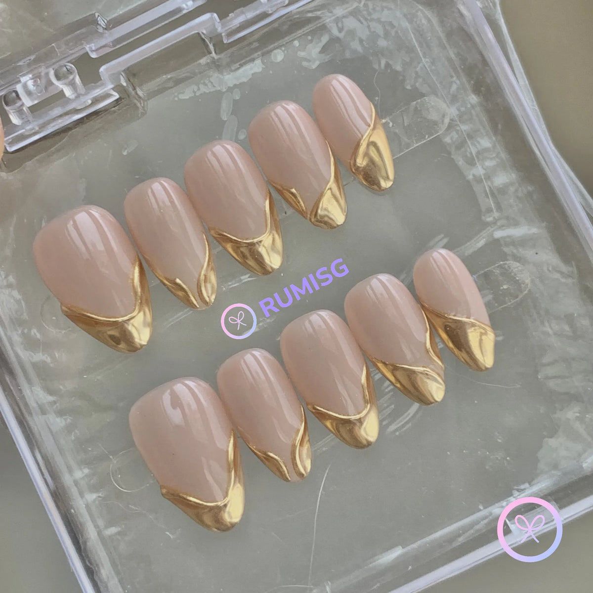 elegant nude glossy short almond press on nails with gold french tip