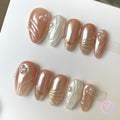 elegant pearlescent nude medium almond press on nails with pearls and cat eyes