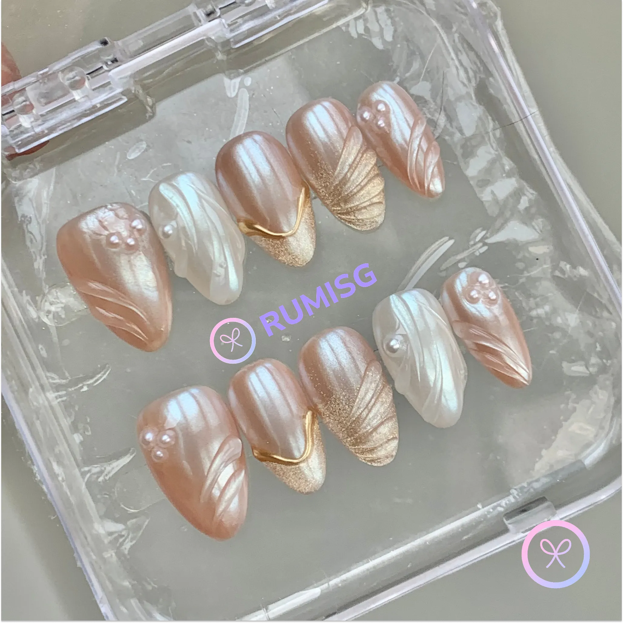 pearlcore nude pearlescent short almond press on nails with swirl and pearl