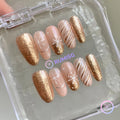 christmas gold glossy snowflake medium oval press on nails with stripe